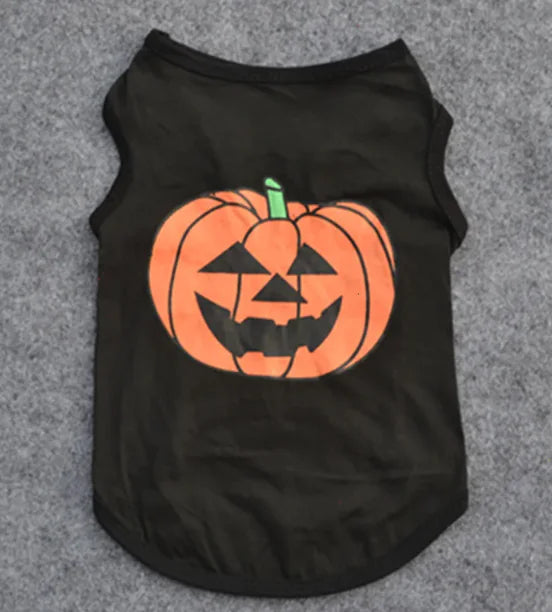 Black pet shirt with a pumpkin design on a gray background