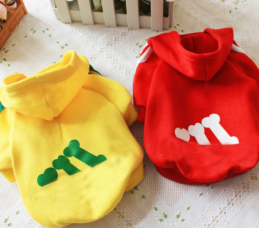 Yellow and red pet hoodies with text on a white lace background