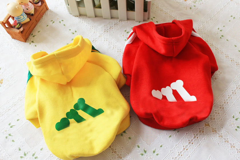 Yellow and red pet hoodies with text on a white lace background