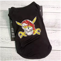 Black tank top with a skull and crossed swords design on a wooden surface