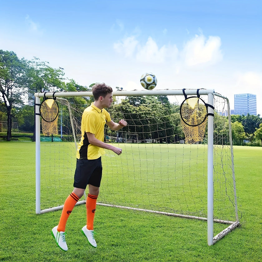 Person playing with a soccer ball on a small goal in a park