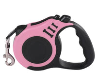 Pink and black retractable dog leash on a white background