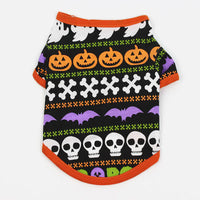 Halloween-themed pet shirt with pumpkins, ghosts, bats, and skulls on a black background.