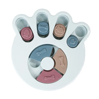 a pastel-colored paw-shaped puzzle toy - uncover kibble stored beneath the sliders.
