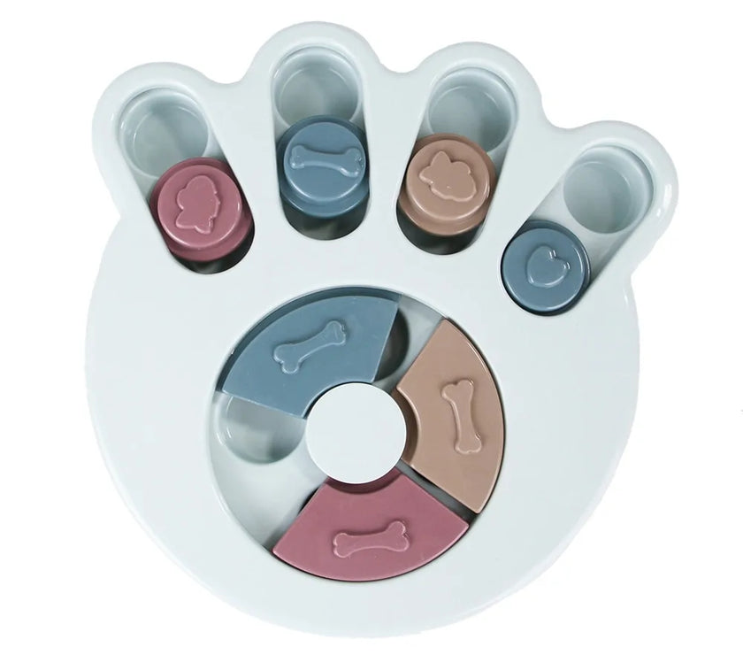 a pastel-colored paw-shaped puzzle toy - uncover kibble stored beneath the sliders.

